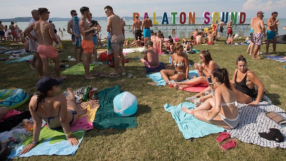 People enjoy summer during the Balaton Sound music festival on the shore of lake Balaton in Zamardi, western Hungary.